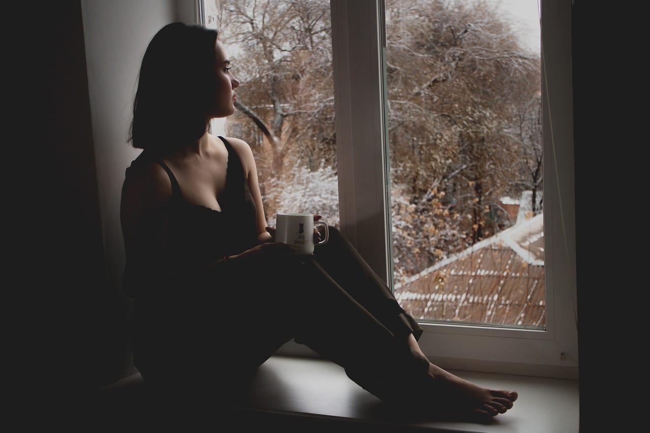 depression girl looking out window