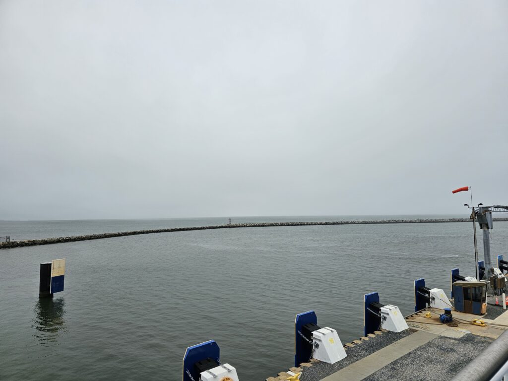 Calm water at the ferry dock in Lewes, Delaware.  an ocean of grief